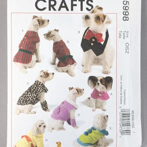 May include: McCall's Crafts sewing pattern M5998 for dog clothing. The envelope features illustrations of dogs wearing various outfits including a red plaid vest, a black tuxedo collar with a red bow tie, a leopard print coat, and colorful sweaters.