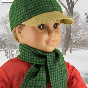 Peut inclure: Une casquette de baseball &agrave; carreaux verts et noirs avec une visi&egrave;re beige et une &eacute;charpe &agrave; carreaux verts et noirs. L'&eacute;charpe a des franges aux extr&eacute;mit&eacute;s.