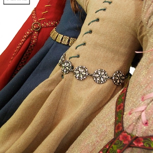 Lee & Pearl Pattern 3001: Late Medieval Lady's Wardrobe for 18 inch dolls such as American Girl — historical doll kirtle (dress), mantle (cloak), shift and girdle (belt). Illustrated historical background information booklet is included.
