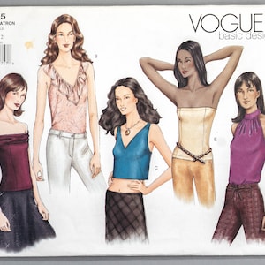 May include: A sewing pattern for five different tops, including a strapless top, an off-the-shoulder top, a halter top, a cropped top, and a ruffled top. The pattern is from Vogue Basic Design and is for sizes 8-10-12.