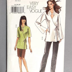 May include: A Very Easy Vogue sewing pattern, V7913, featuring wrap tops and trousers. The pattern includes sizes 14, 16, and 18. The cover art shows two women wearing the garments. The pattern is for a variety of sizes.