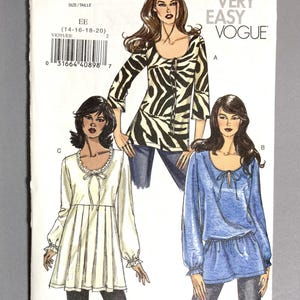May include: A Very Easy Vogue sewing pattern, V8291, featuring illustrations of three different blouses. The blouses include a zebra print top, a white top with a ruffled neckline, and a blue top with long sleeves. The pattern size is EE (14-16-18-20).