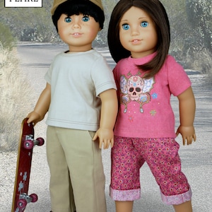 May include: Two dolls, one wearing a beige t-shirt, khaki pants, and a brown baseball cap, holding a red skateboard, and the other wearing a pink t-shirt with a skull and flower design, pink and white floral pants, and red sandals.  The dolls are standing on a gray sidewalk.