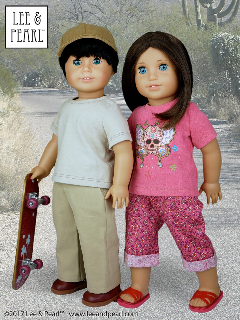 May include: Two dolls, one wearing a beige t-shirt, khaki pants, and a brown baseball cap, holding a red skateboard, and the other wearing a pink t-shirt with a skull and flower design, pink and white floral pants, and red sandals.  The dolls are standing on a gray sidewalk.