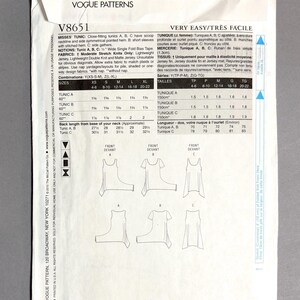May include: Vogue Patterns sewing pattern V8651 for misses' tunics. The pattern includes instructions for close-fitting tunics with scoop necklines and asymmetrical hems. Fabric suggestions and size charts are also included.