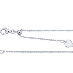 May include: A silver chain necklace with a heart charm and a sliding bead to adjust the length.