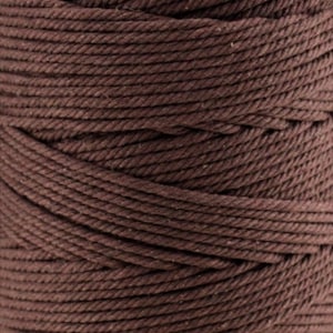 May include: A spool of dark brown macrame cord featuring a tightly twisted three-ply construction. The thick, fibrous rope is wound in uniform, horizontal layers, creating a consistent texture across the entire surface of the cylindrical spool.