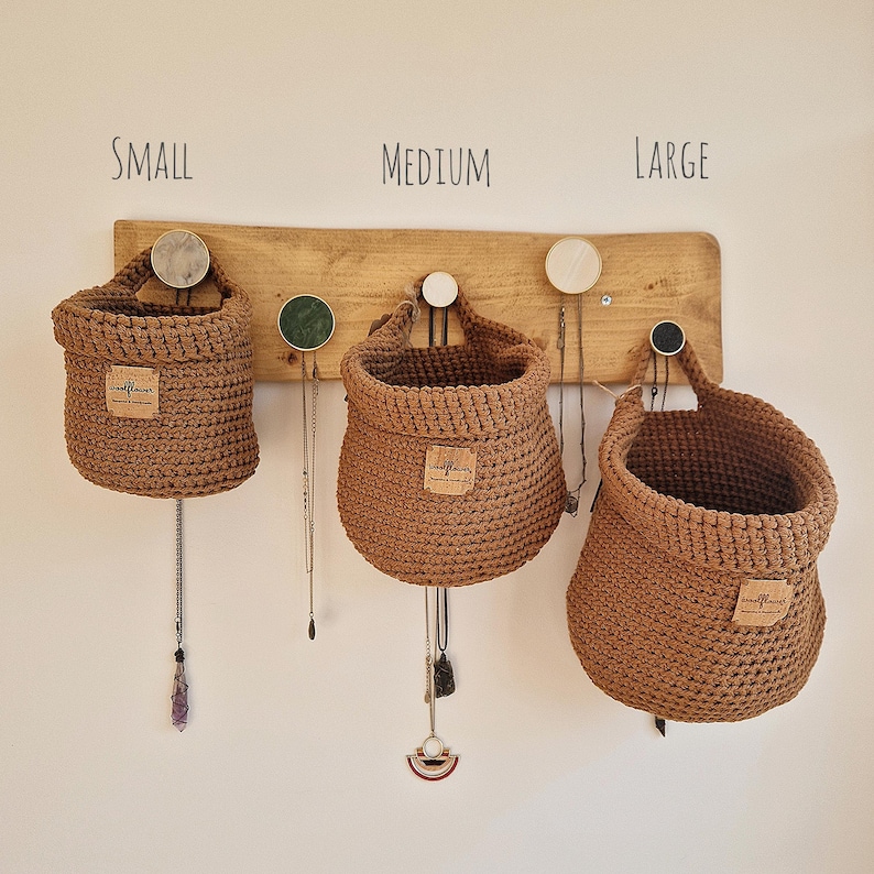 Brown crochet hanging baskets, perfect storage for organising bedrooms, bathrooms, kitchens and nurseries, on Etsy by Woolflowerdesigns. A great new home and house warming gift.