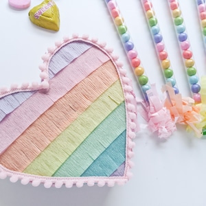 Pastel rainbow stripe heart mini pinata| ONE pinata | Valentine&#39;s Day party, Valentine heart pinata, pastel rainbow birthday party decor