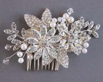 A Floral Crystal Wedding Hair Comb perfect for a bride or bridesmaid to style in their hair. A pearl and crystal flower hair accessory