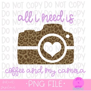 May include: A digital graphic design featuring a brown and white leopard print camera with a white heart in the viewfinder. The text "all i need is coffee and my camera" is written in purple above the camera.