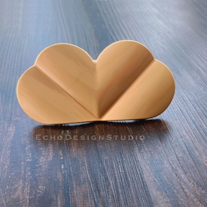 May include: A wooden cloud-shaped decorative object with a light brown finish.
