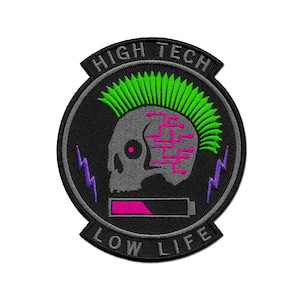 May include: A black and grey embroidered patch featuring a skull with a green mohawk. The skull has pink and purple circuitry inside its head. The patch reads "High Tech Low Life" in a grey, white, and purple font.