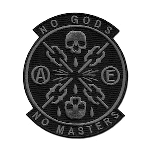 May include: Black and gray embroidered patch with the text "No Gods No Masters" and two skull designs. The patch also features the letters "A" and "E" in circles.