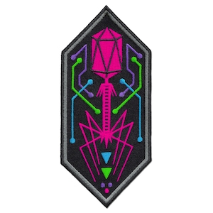 May include: Embroidered patch with a geometric design in a shield shape. The patch features a black background with a pink, green, blue, and purple design. The design includes a geometric shape at the top, lines, and dots.