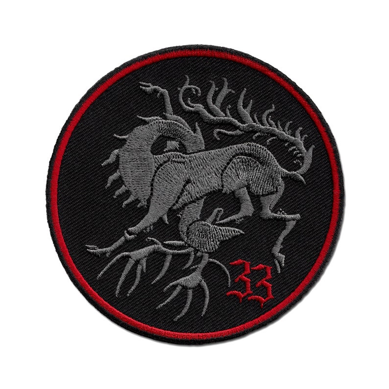 May include: Black and red embroidered patch with a gray, multi-legged creature and the number 33 in red.