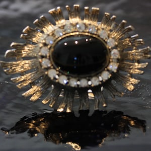 Wonderfully detailed large silver and onyx brooch.