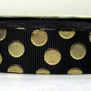 May include: Black grosgrain ribbon with gold polka dots.
