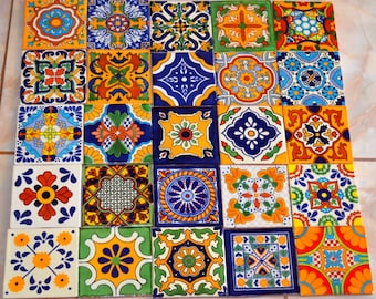May include: A collection of twenty-five square ceramic tiles with intricate, colorful patterns. The tiles feature a variety of designs in shades of blue, yellow, orange, green, and white. Each tile showcases a unique floral or geometric motif, creating a vibrant and decorative display.
