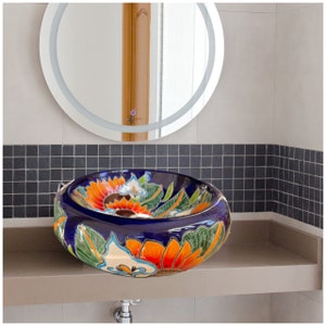 A round sink that goes on top of the cabinet