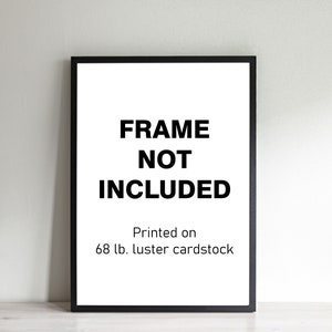 May include: Black frame with a white background and the text "FRAME NOT INCLUDED" and "Printed on 68 lb. luster cardstock".