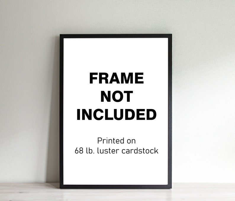 May include: Black frame with a white background and the text "FRAME NOT INCLUDED" and "Printed on 68 lb. luster cardstock".