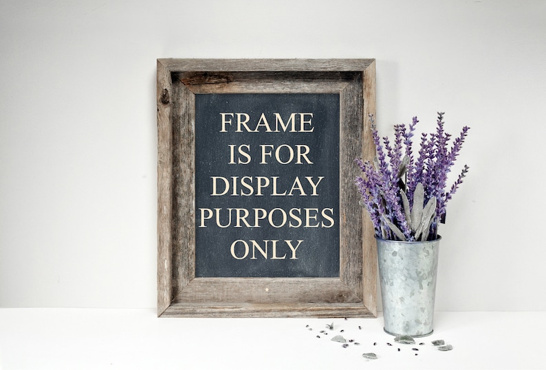 May include: A rustic wooden frame with a black chalkboard insert that reads "FRAME IS FOR DISPLAY PURPOSES ONLY". A bouquet of purple lavender flowers is in a galvanized metal vase.