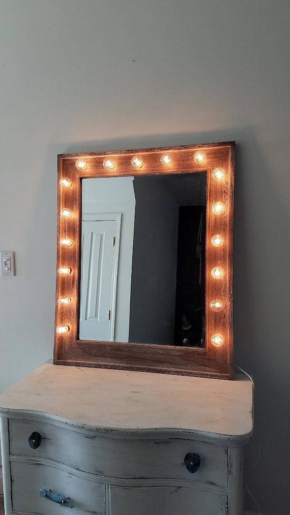 Wooden vanity mirror with cheap lights