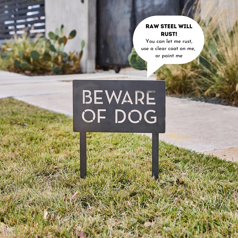 May include: A black metal sign with the words "BEWARE OF DOG" in white lettering. A speech bubble above the sign reads "RAW STEEL WILL RUST! You can let me rust, use a clear coat on me, or paint me."