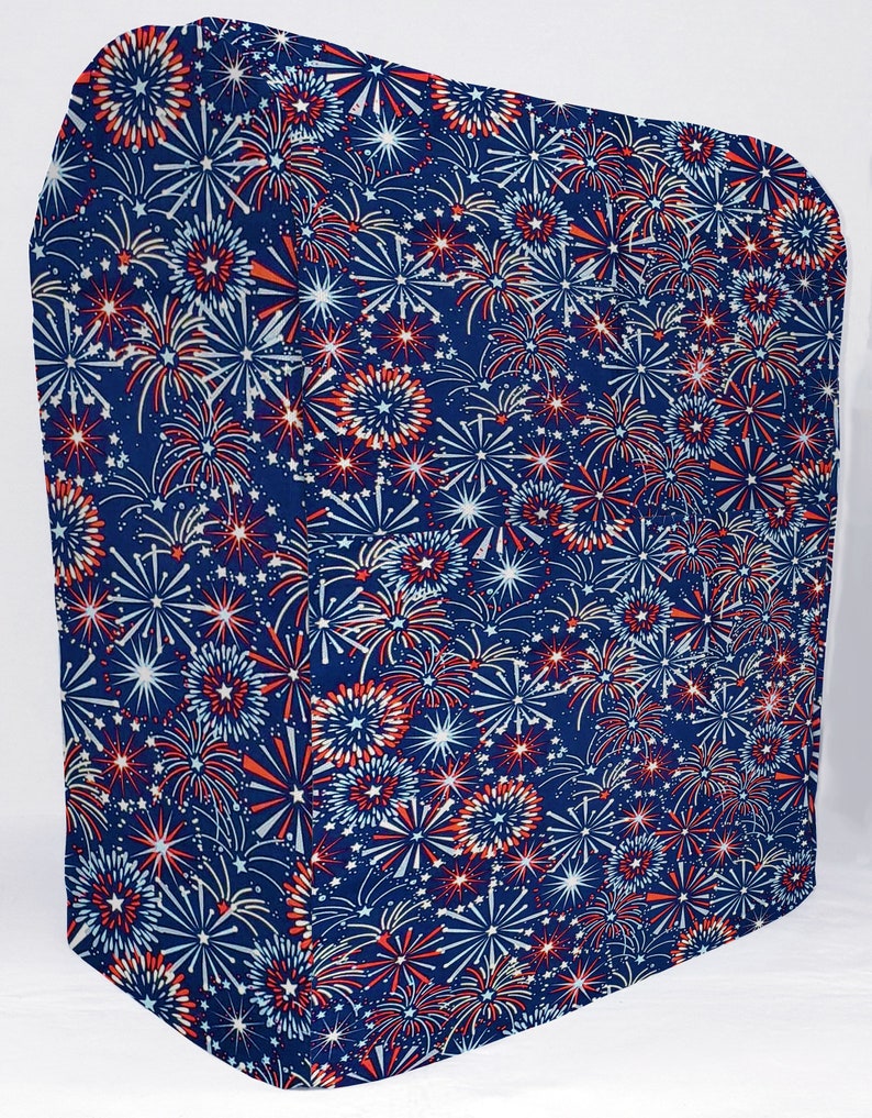 May include: A blue fabric cover with a red, white, and blue fireworks pattern. The cover is made of a soft, durable fabric and is perfect for protecting furniture or other items.
