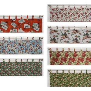 May include: Set of six Christmas-themed fabric valances with various patterns, including red and white, blue and white, green and white, and red and green.