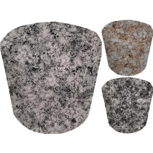 May include: Three round fabric ottoman footstools with a vintage floral pattern. The footstools are in black and white, brown and white, and black and white.