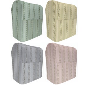 May include: Four refrigerator covers with a vertical striped pattern. The covers are in green, yellow, blue, and pink.