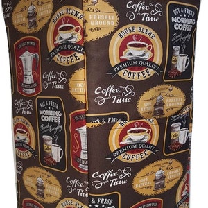 May include: A brown fabric with a repeating pattern of coffee-themed illustrations. The illustrations feature coffee cups, coffee beans, coffee grinders, and text that says "Coffee & Time", "House Blend", "Premium Quality Coffee", "Hot & Fresh Morning Coffee", and "100% Natural".