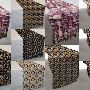 May include: A set of ten table runners featuring different designs with a wine and beer theme. The designs include wine bottles, glasses, and text related to wine and beer. The table runners are all 14 inches wide and 70 inches long.