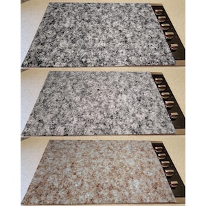 May include: Three stovetop protectors with different patterns. The first protector has a black and white marble pattern. The second protector has a gray and white marble pattern. The third protector has a brown and white marble pattern.