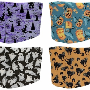 May include: Four different fabric designs featuring Halloween themes. The first design is purple with witches, bats, and trees. The second design is blue with pumpkins and stars. The third design is black with white ghosts. The fourth design is orange with black cats.