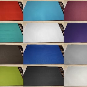 May include: Ten different color swatches of fabric. The colors are red, turquoise, burgundy, purple, dark brown, royal blue, gray, lime green, black, and white.