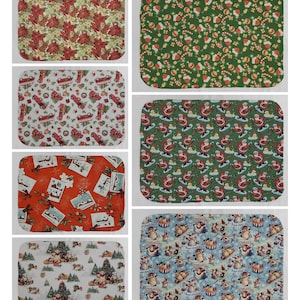 May include: Set of eight Christmas-themed placemats featuring various holiday designs. The placemats are rectangular and feature a variety of patterns, including poinsettias, Santa Claus, snowmen, and Christmas trees.