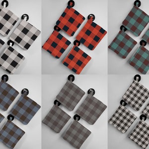 May include: Set of four plaid pot holders in various color combinations, including black and white, red and black, teal and brown, and gray and brown.