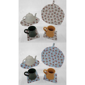 May include: Two sets of teacups and teapot with matching tea cozy. The teacups are green and orange. The teapot is white. The tea cozies are white with red birds and blue with red birds.