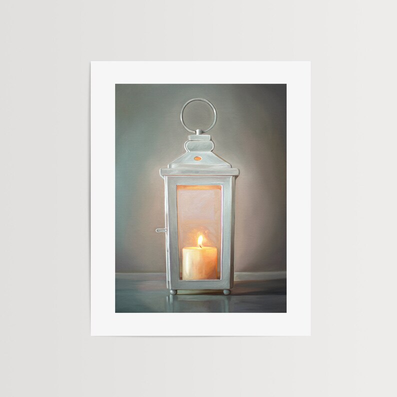 The artwork features a white lantern with a lit candle glowing on the inside.