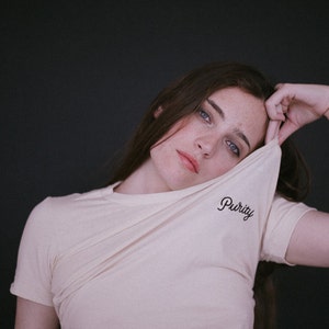 Tshirt. lettering Purity embroidery in black