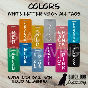 a collection of colorful tags with white lettering, arranged on a wooden surface.