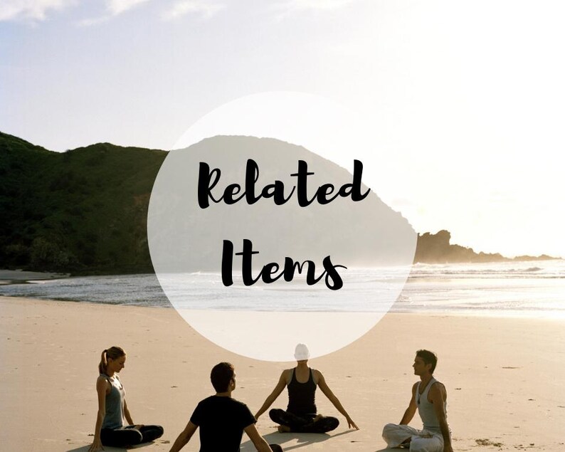 May include: Four individuals sit in a cross-legged meditation pose on a sandy beach near the ocean. A large, semi-transparent white circle is overlaid in the center of the image, featuring the black text Related Items written in a script font.