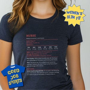 May include: A navy blue t-shirt with the word "NURSE" and game statistics printed in white. The shirt also features the text "GOOD JOB SHIRTS" on a blue shirt graphic and "WOMEN'S SLIM FIT" on a yellow starburst.