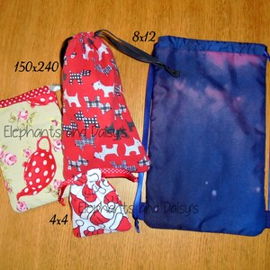 May include: Four drawstring bags in different sizes and patterns. The largest bag is blue with a galaxy print and measures 8x12 inches. The smallest bag is red with a dog print and measures 4x4 inches. The other two bags are 5x7 inches and 150x240 inches. All bags have the text "Elephants and Daisy's" printed on them.