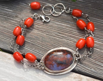 Red moss agate encased in sterling silver with red coral beads composed into a unique bracelet,hand forged oxidised sterling silver bracelet