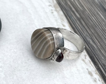 Statement ring in sterling silver,striped flint with garnet ring, artisan ring with textured band,contemporary organic ring,oxidized silver