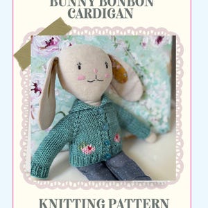 May include: A plush bunny doll wearing a teal knitted cardigan with floral accents and blue jeans. The image includes the text "Bunny Bonbon Cardigan" and "Knitting Pattern". The doll has long ears and is set against a floral background.